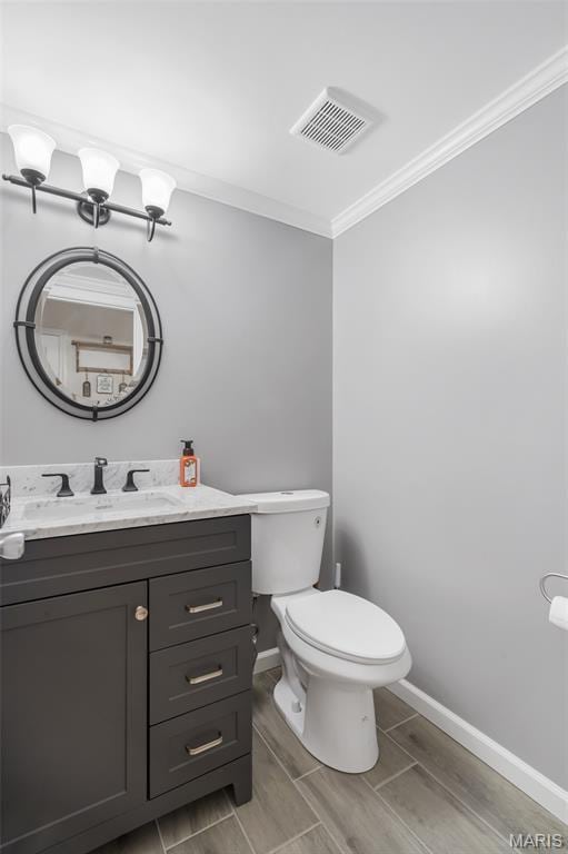 116 Shirewood Dr, Saint Charles, MO 63303 - half bathroom featuring vanity, crown molding, and wood tiled floors