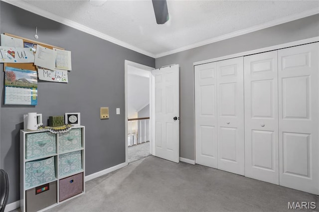 116 Shirewood Dr, Saint Charles, MO 63303 - bedroom featuring carpet flooring, crown molding, a textured ceiling, a closet, and a ceiling fan