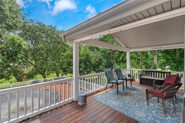 116 Shirewood Dr, Saint Charles, MO 63303 - wooden deck with an outdoor hangout area and view of scattered trees
