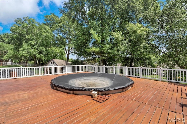 116 Shirewood Dr, Saint Charles, MO 63303 - wooden terrace featuring a storage unit and view of wooded area