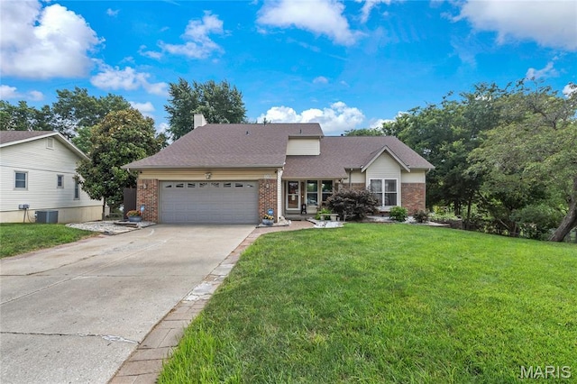 116 Shirewood Dr, Saint Charles, MO 63303 - view of front of property featuring brick siding, an attached garage, driveway, a front yard, and a chimney
