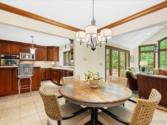 2254 Ridgley Woods Dr, Chesterfield, MO 63005 - dining space with light tile patterned flooring, a chandelier, vaulted ceiling, and recessed lighting