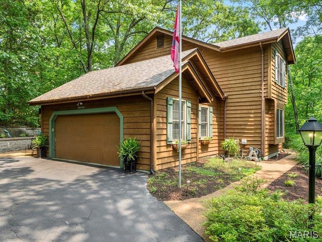 2254 Ridgley Woods Dr, Chesterfield, MO 63005 - view of front of house with a shingled roof and driveway