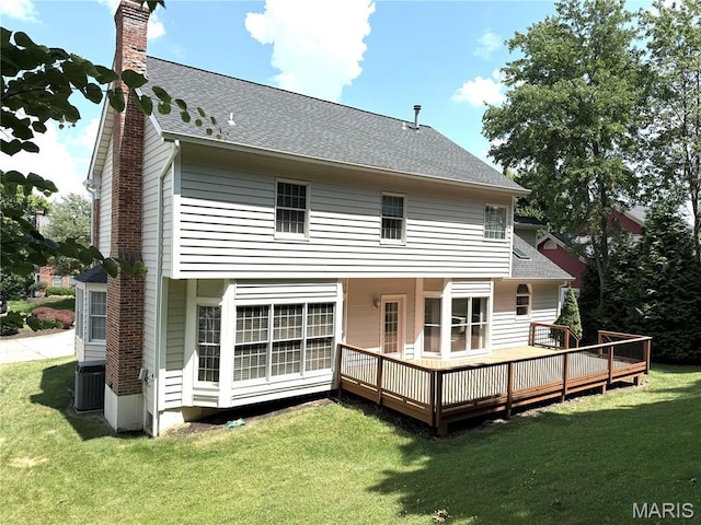 720 Woodridge Heights Ct, Manchester, MO 63011 - back of property with a chimney, a yard, a wooden deck, and a shingled roof