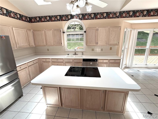 720 Woodridge Heights Ct, Manchester, MO 63011 - kitchen featuring appliances with stainless steel finishes, light brown cabinets, backsplash, light countertops, and lofted ceiling