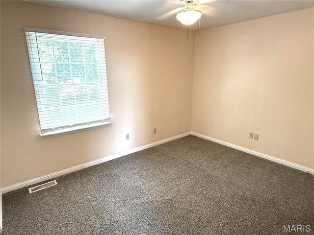 720 Woodridge Heights Ct, Manchester, MO 63011 - empty room featuring dark carpet and a ceiling fan