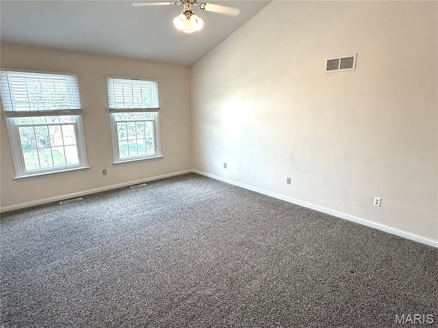 720 Woodridge Heights Ct, Manchester, MO 63011 - spare room with vaulted ceiling, dark carpet, and ceiling fan