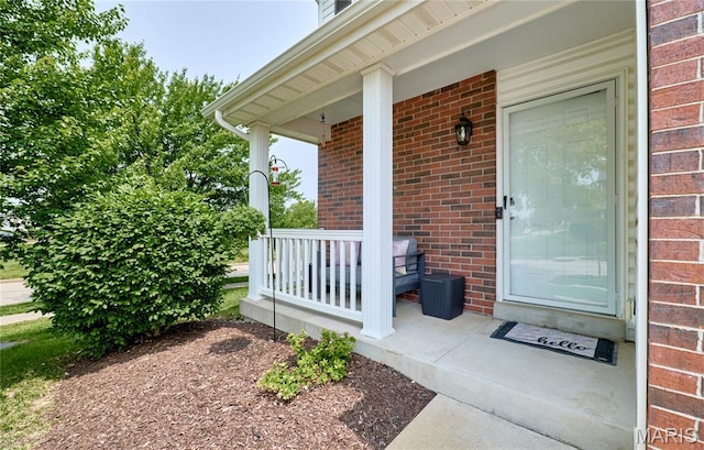 228 Centerfield Dr, Ofallon, MO 63366 - property entrance with a porch and brick siding