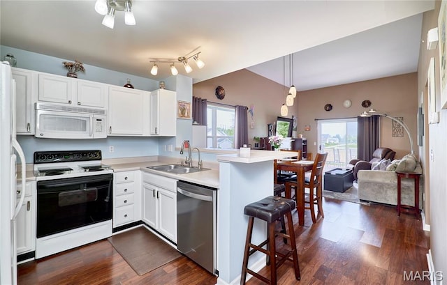 228 Centerfield Dr, Ofallon, MO 63366 - kitchen with electric range oven, dishwasher, white microwave, a peninsula, and open floor plan