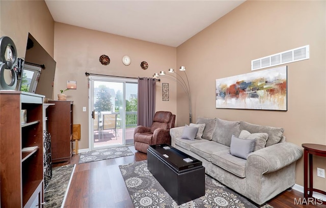 228 Centerfield Dr, Ofallon, MO 63366 - living area featuring wood finished floors and vaulted ceiling