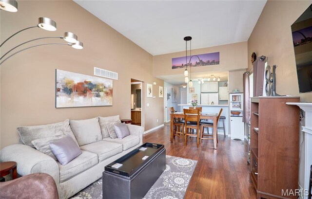 228 Centerfield Dr, Ofallon, MO 63366 - living room with dark wood-style floors and baseboards