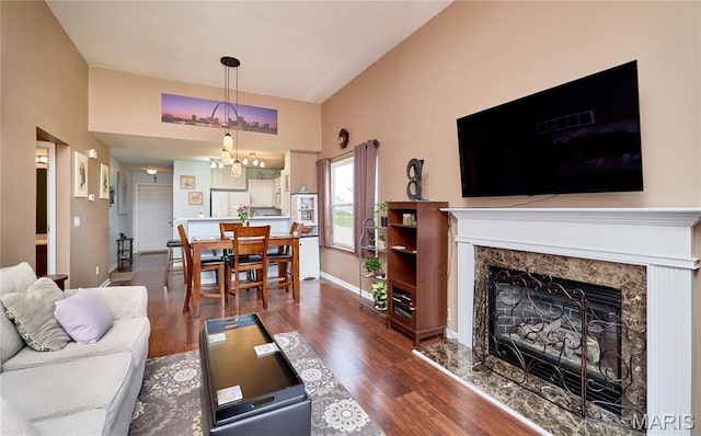 228 Centerfield Dr, Ofallon, MO 63366 - living area featuring wood finished floors, a chandelier, and a fireplace