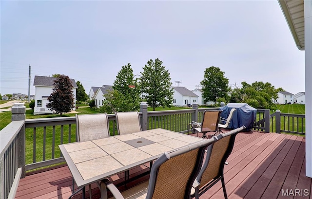 228 Centerfield Dr, Ofallon, MO 63366 - wooden terrace with outdoor dining space, a lawn, a residential view, and grilling area