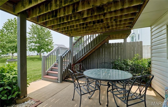 228 Centerfield Dr, Ofallon, MO 63366 - view of patio / terrace featuring stairs and outdoor dining area