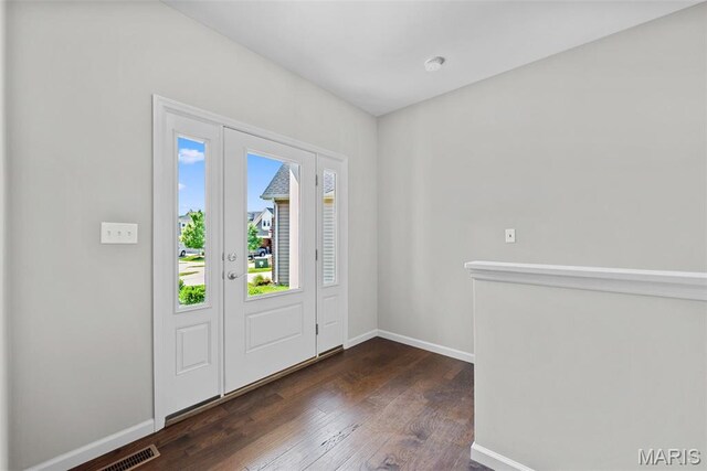 14 Ivyleigh Ct, Saint Charles, MO 63303 - foyer featuring baseboards and dark wood-type flooring