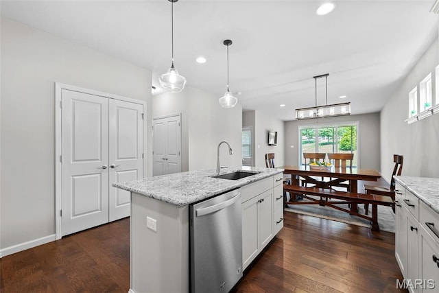 14 Ivyleigh Ct, Saint Charles, MO 63303 - kitchen with stainless steel dishwasher, dark wood-type flooring, recessed lighting, white cabinets, and a kitchen island with sink