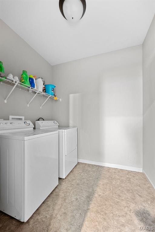 14 Ivyleigh Ct, Saint Charles, MO 63303 - laundry area with washer and clothes dryer and tile patterned floors