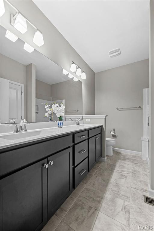 14 Ivyleigh Ct, Saint Charles, MO 63303 - full bathroom featuring double vanity, marble finish floors, and a bidet