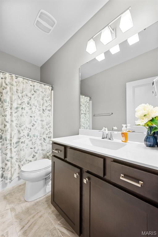 14 Ivyleigh Ct, Saint Charles, MO 63303 - bathroom with vanity, a shower with curtain, and tile patterned flooring