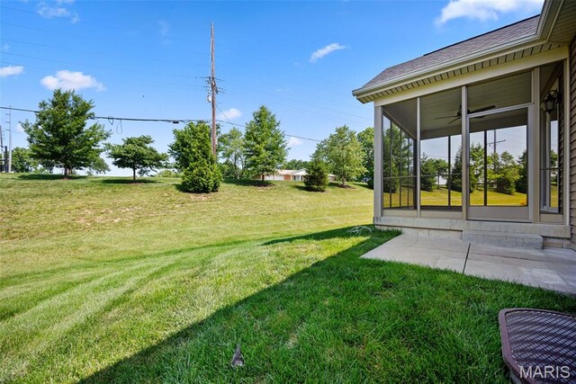 14 Ivyleigh Ct, Saint Charles, MO 63303 - view of grassy yard with a sunroom and a ceiling fan