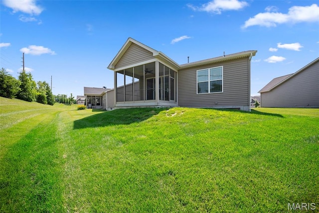 14 Ivyleigh Ct, Saint Charles, MO 63303 - back of house featuring a sunroom, a ceiling fan, and a yard