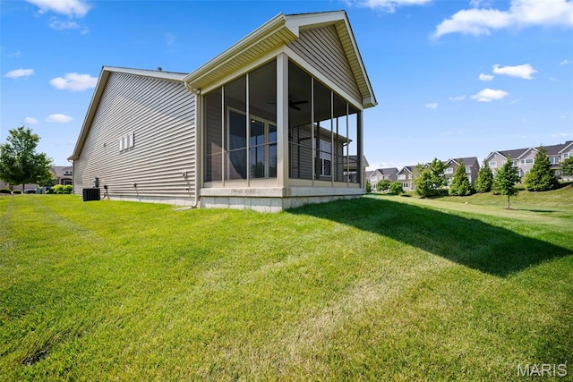 14 Ivyleigh Ct, Saint Charles, MO 63303 - back of property with a sunroom, a lawn, a residential view, and a ceiling fan