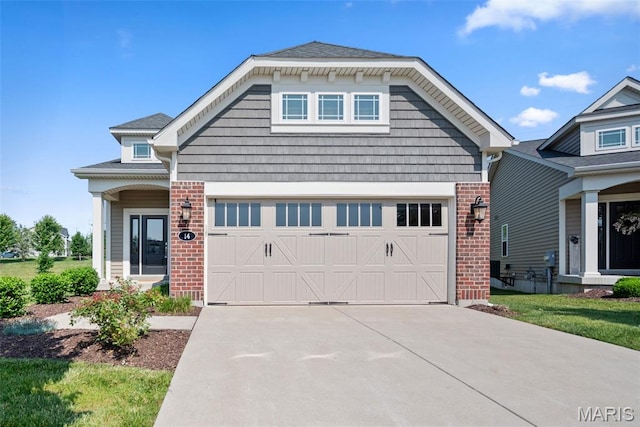 14 Ivyleigh Ct, Saint Charles, MO 63303 - craftsman house with brick siding and concrete driveway