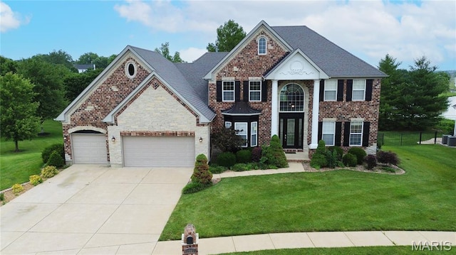 1008 Castleview Ct, Cottleville, MO 63304 - view of front of home featuring concrete driveway, an attached garage, and brick siding
