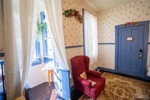 415 E 1st St, Hermann, MO 65041 - sitting room featuring wood finished floors and wallpapered walls