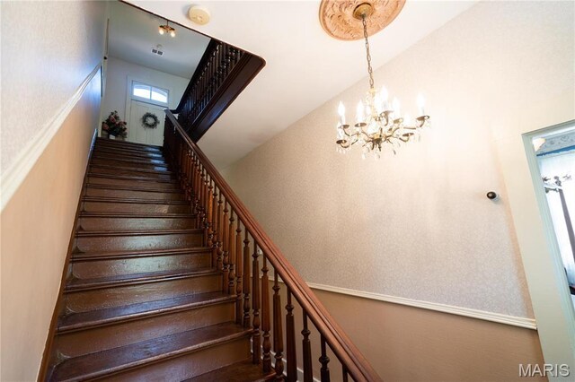 415 E 1st St, Hermann, MO 65041 - stairs featuring a chandelier