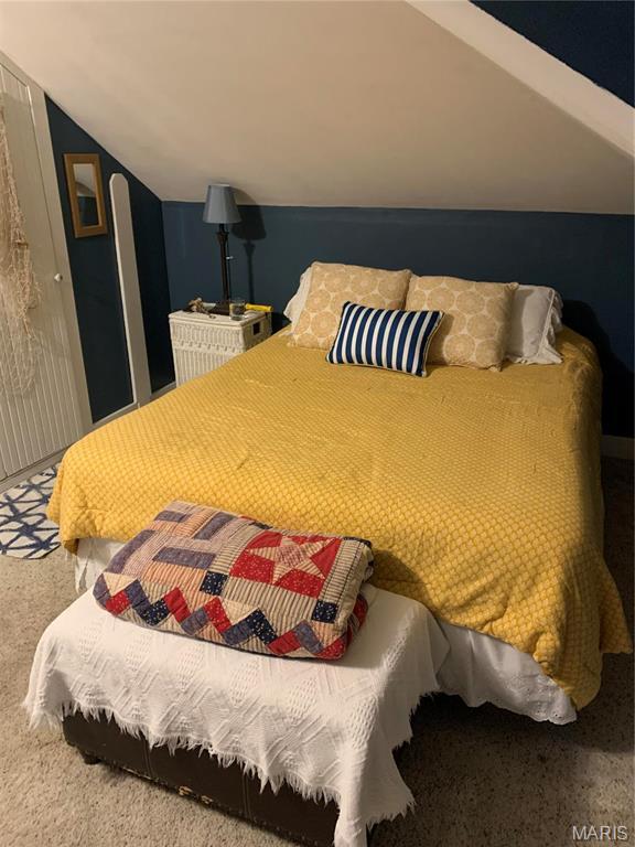 415 E 1st St, Hermann, MO 65041 - carpeted bedroom with vaulted ceiling