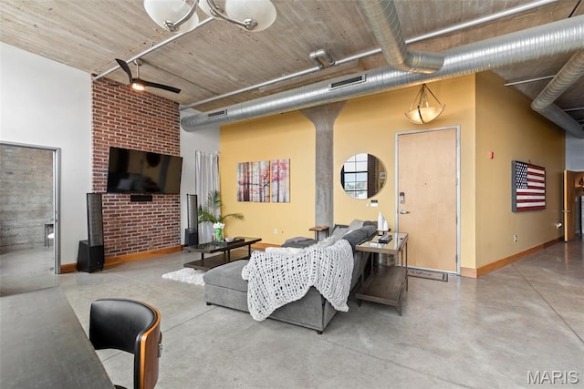 2323 Locust St Unit 308, Saint Louis, MO 63103 - living room featuring finished concrete floors, a ceiling fan, baseboards, and a high ceiling