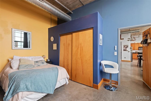2323 Locust St Unit 308, Saint Louis, MO 63103 - bedroom featuring a towering ceiling, a closet, and baseboards
