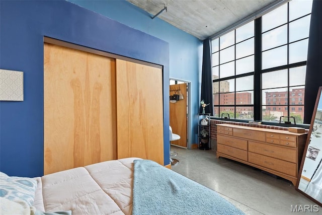 2323 Locust St Unit 308, Saint Louis, MO 63103 - bedroom featuring concrete flooring and a closet