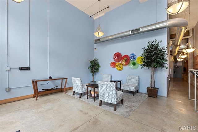 2323 Locust St Unit 308, Saint Louis, MO 63103 - dining room with a high ceiling and finished concrete floors