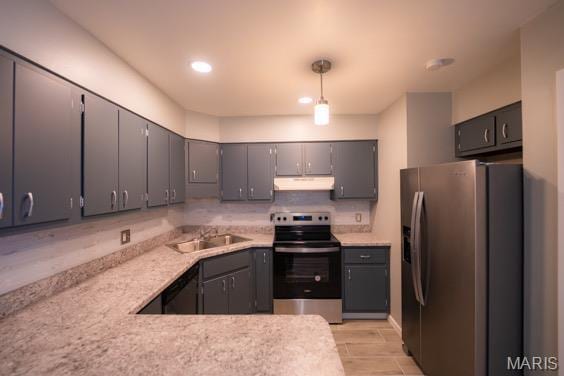 9145 Villaridge Ct H, Unit H, MO 63123 - kitchen featuring appliances with stainless steel finishes, under cabinet range hood, light countertops, gray cabinetry, and a peninsula