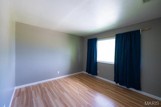 9145 Villaridge Ct H, Unit H, MO 63123 - empty room featuring wood finished floors and baseboards