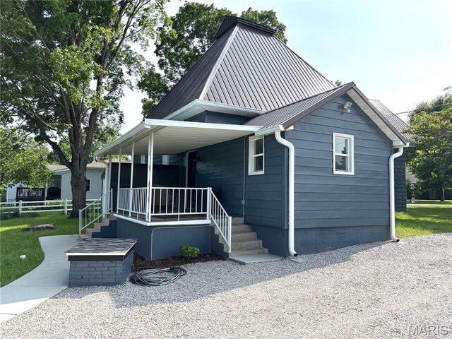 10216 High St, Belgrade, MO 63622 - view of front of house with covered porch and metal roof