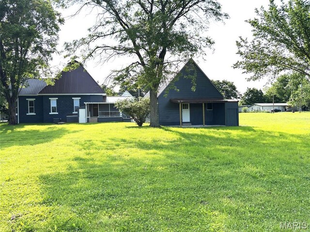 10216 High St, Belgrade, MO 63622 - rear view of house featuring a yard