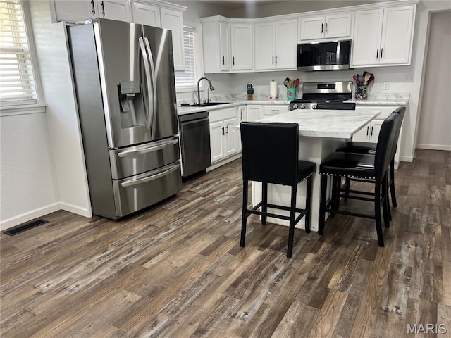 403 E Summit St, Doniphan, MO 63935 - kitchen with stainless steel appliances, a sink, white cabinetry, and baseboards
