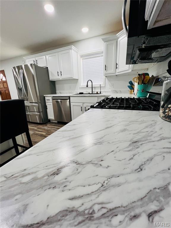 403 E Summit St, Doniphan, MO 63935 - kitchen with appliances with stainless steel finishes, a sink, white cabinetry, dark wood-style flooring, and recessed lighting