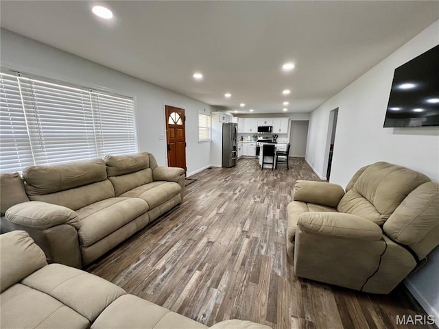403 E Summit St, Doniphan, MO 63935 - living area with dark wood finished floors, recessed lighting, and baseboards