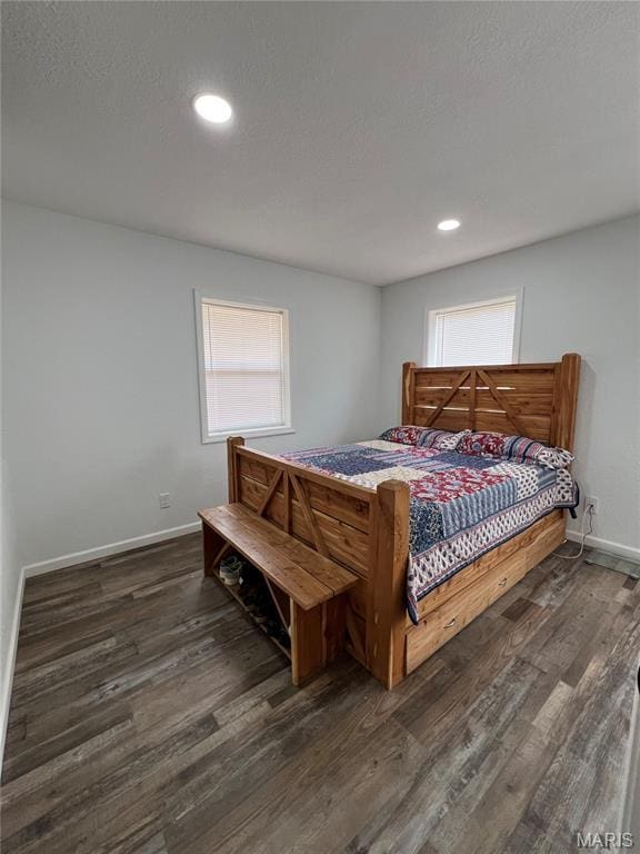 403 E Summit St, Doniphan, MO 63935 - bedroom with dark wood-style flooring, multiple windows, baseboards, and recessed lighting