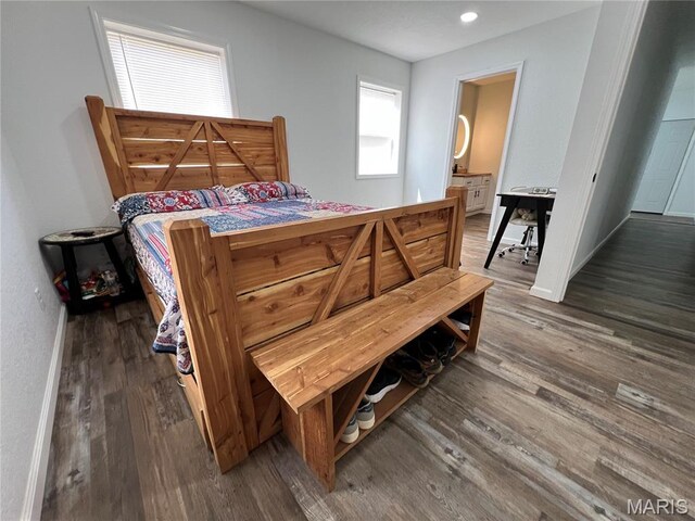 403 E Summit St, Doniphan, MO 63935 - bedroom featuring wood finished floors, ensuite bathroom, and baseboards