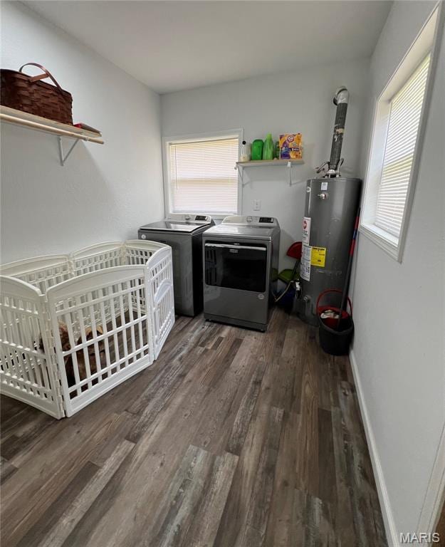 403 E Summit St, Doniphan, MO 63935 - washroom with water heater, washer and dryer, wood finished floors, and baseboards