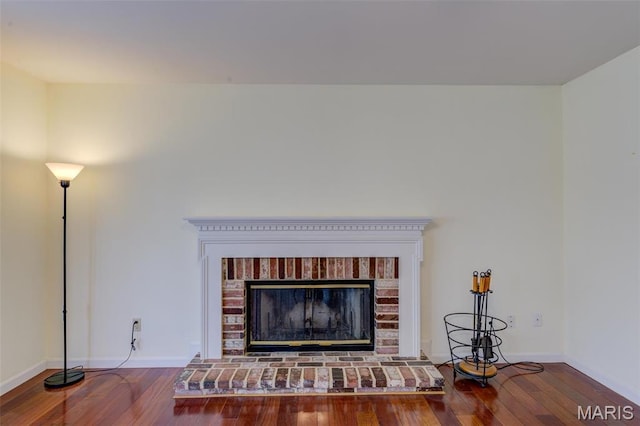 12118 Fahrpark Ln, Saint Louis, MO 63146 - detailed view of wood finished floors, a brick fireplace, and baseboards