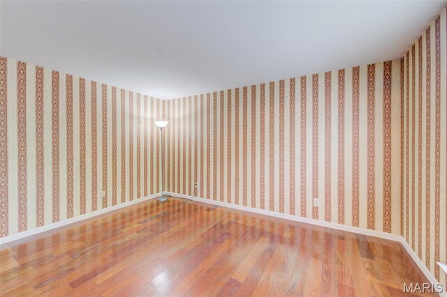 12118 Fahrpark Ln, Saint Louis, MO 63146 - empty room with hardwood / wood-style floors and baseboards