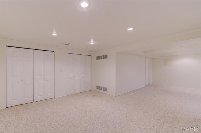 12118 Fahrpark Ln, Saint Louis, MO 63146 - unfurnished bedroom with multiple closets, recessed lighting, ornamental molding, carpet, and baseboards