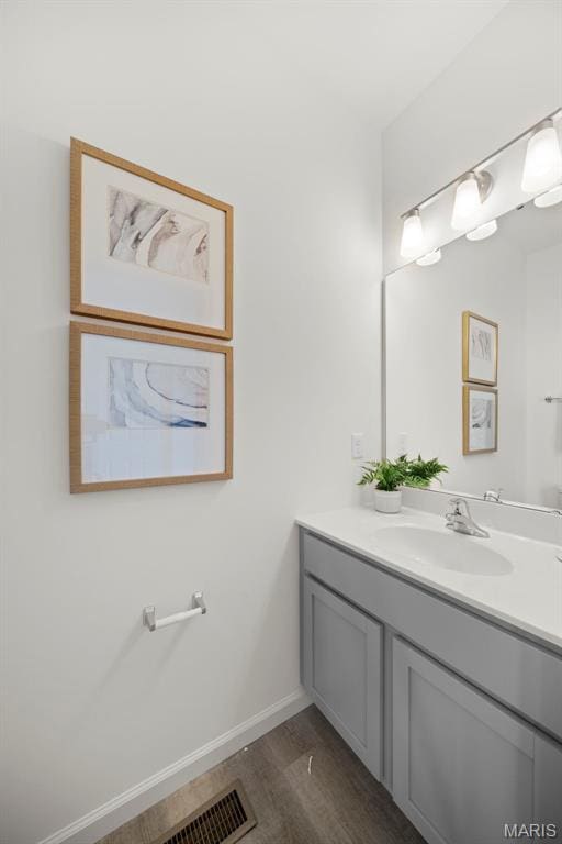 3063 Pirogue St, Saint Charles, MO 63301 - bathroom with vanity, wood finished floors, and baseboards