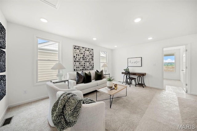 3063 Pirogue St, Saint Charles, MO 63301 - living room featuring light colored carpet, baseboards, and recessed lighting